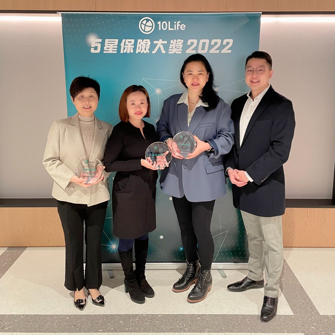 (From left) Ms. Quinney Tang, Division Head, Product Development, Ms. Ady Law, Chief Distribution and Marketing Officer and Ms. Cecilia Chang, Chief Executive Officer of Generali Hong Kong received the trophies from Thomson Ho, Co-Founder of 10Life.
