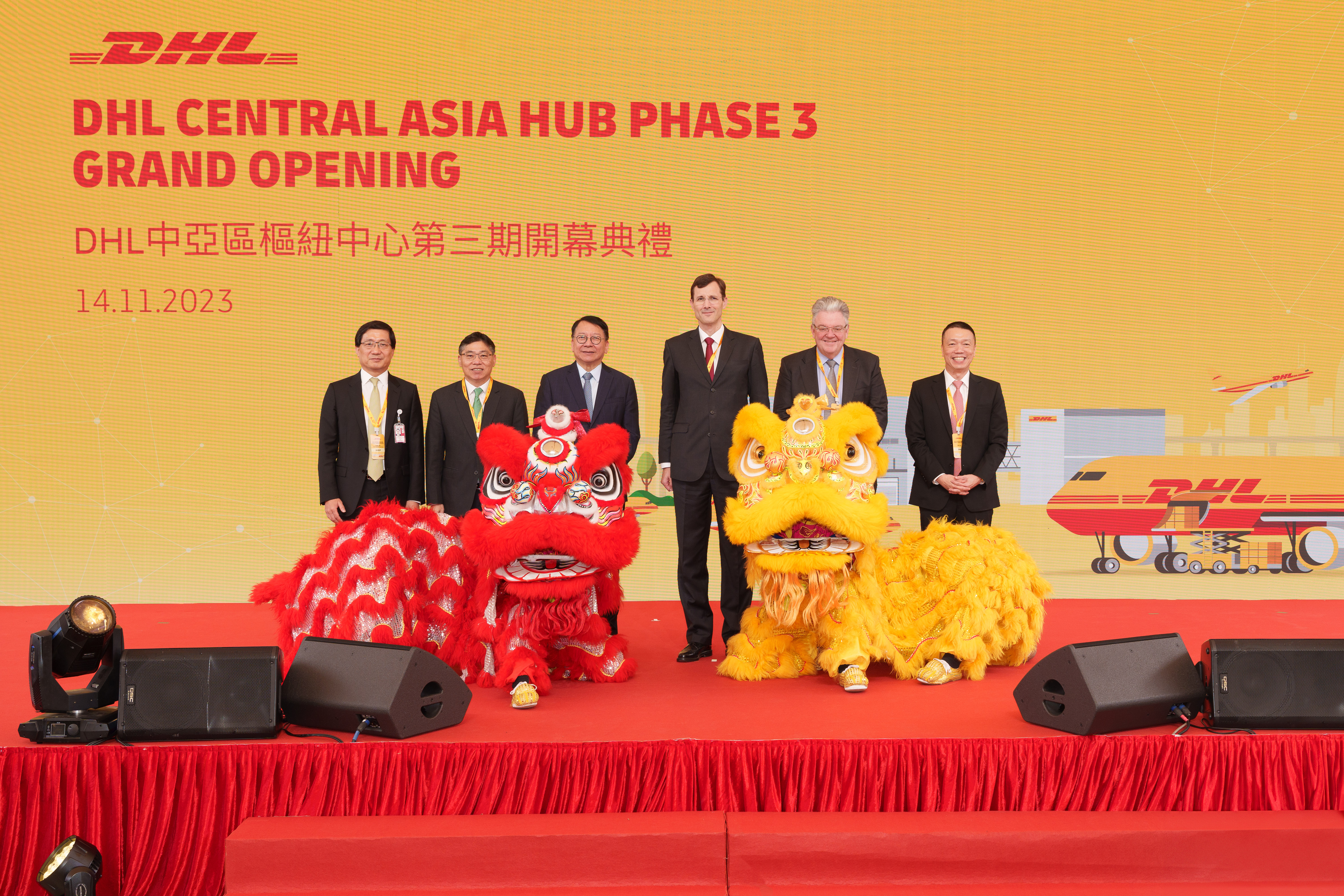 KK Chan, Chief Secretary for Administration of the Government of the Hong Kong Special Administrative, Guest of Honor (third from left) and officiating guests at the lion dance eye-dotting ceremony to mark the opening of the DHL Central Asia Hub expansion, demonstrating DHL's commitment to supporting customers' international growth. Officiating guests include: Lam Sai-hung, Secretary for Transport and Logistics of the Government of the Hong Kong Special Administrative (second from left);Fred Lam, CEO of Airport Authority Hong Kong (first from left);Tobias Meyer, CEO of DHL Group (third from right);John Pearson, CEO of DHL Express (second from right); andKen Lee, CEO of DHL Express Asia Pacific (first from right). Officiating guests are captured in a moment with a DHL aircraft on the airside of the expanded Central Asia Hub in Hong Kong. With direct access to airside and landside, CAH is currently the only dedicated and purpose-built air express cargo facility in the Hong Kong International Airport